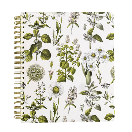 a spiral notebook with a flower pattern on it.