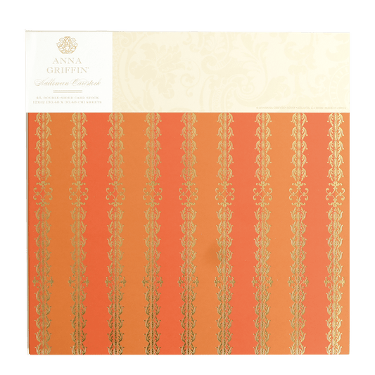 a close up of a piece of paper with gold foil.