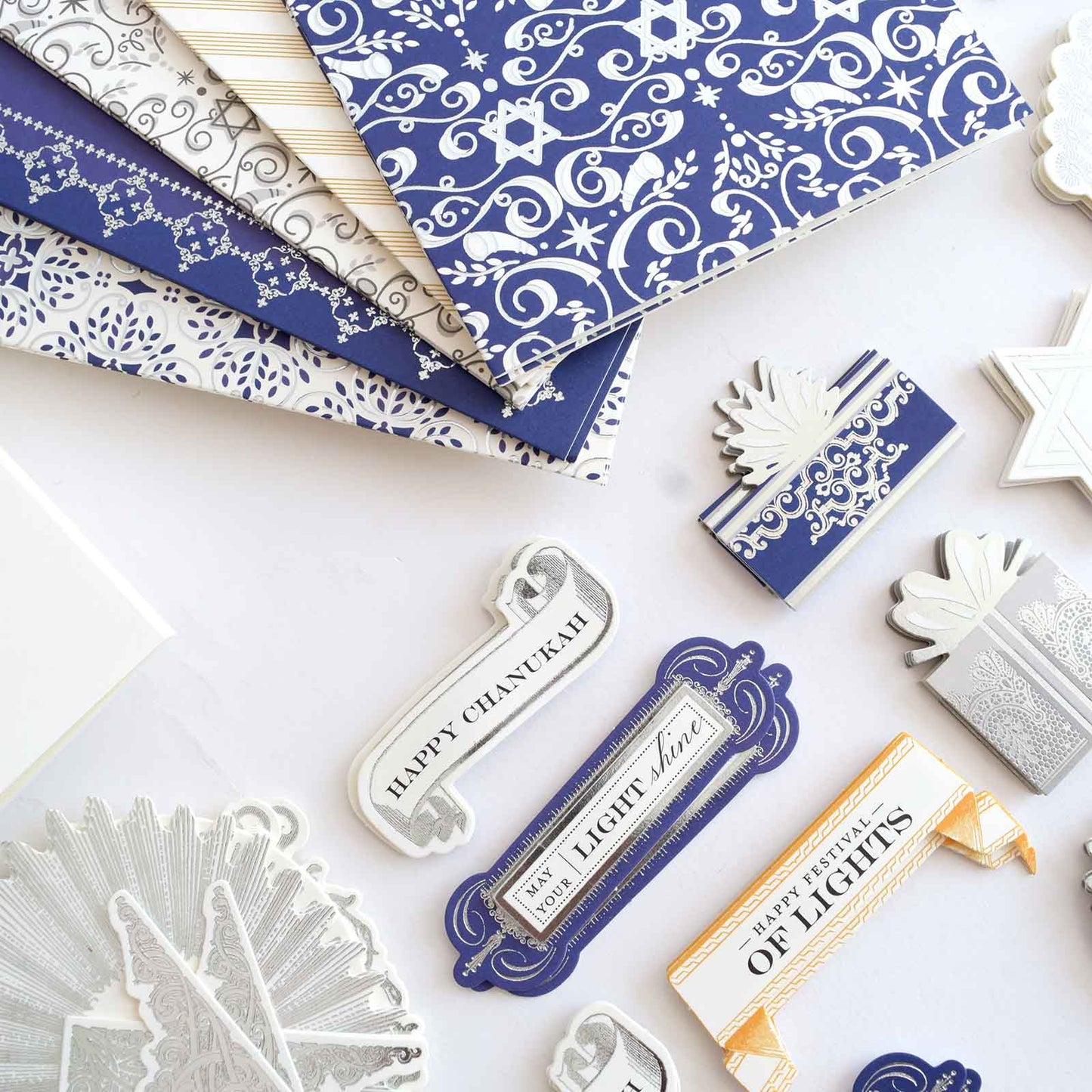 a table topped with lots of different types of paper.