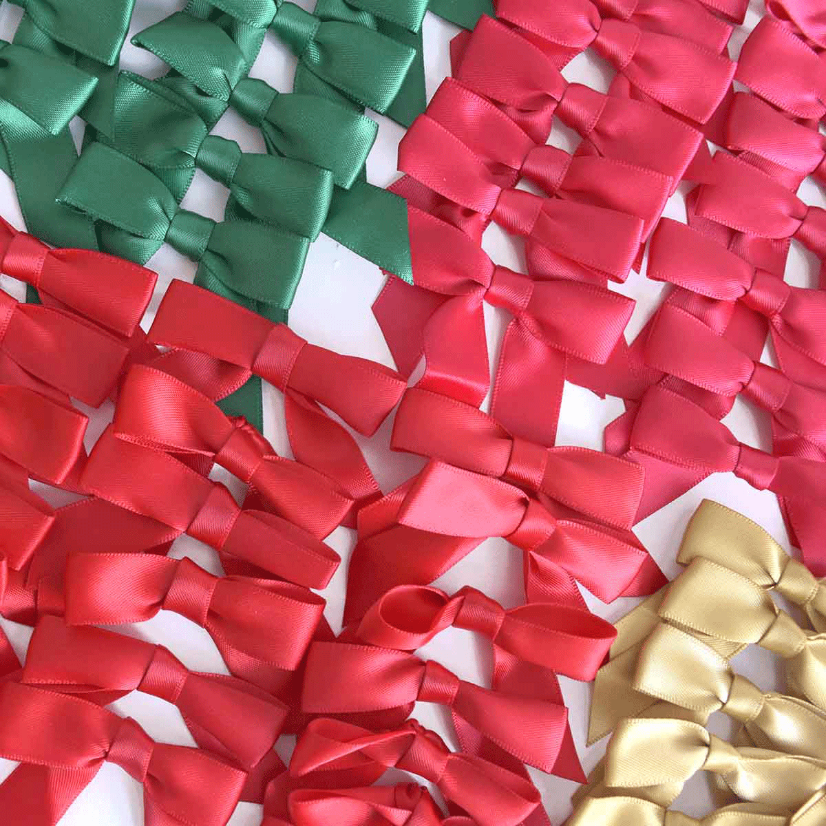 a bunch of different colored bows on a table.