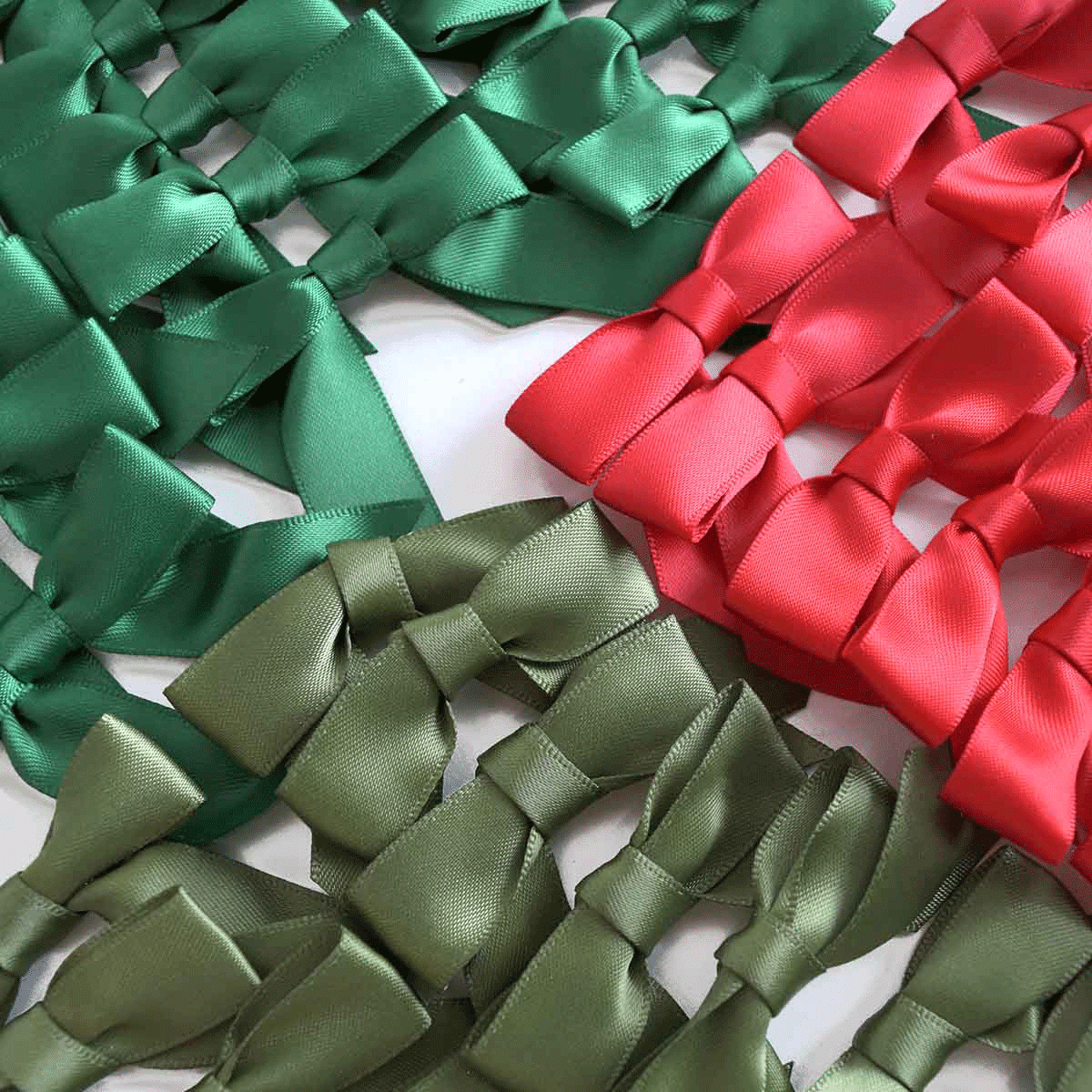 a bunch of different colored bows on a table.