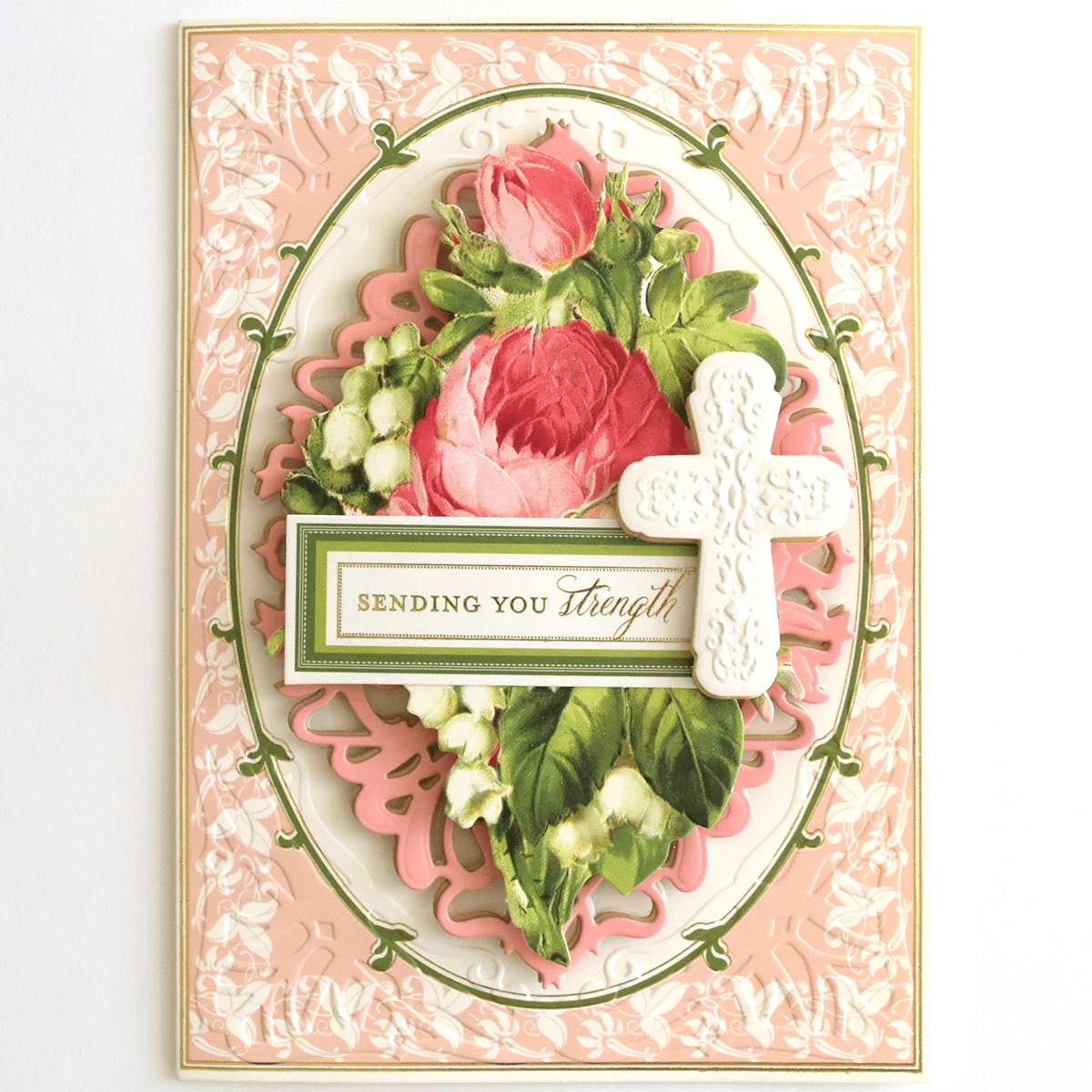 a card with a cross and flowers on it.