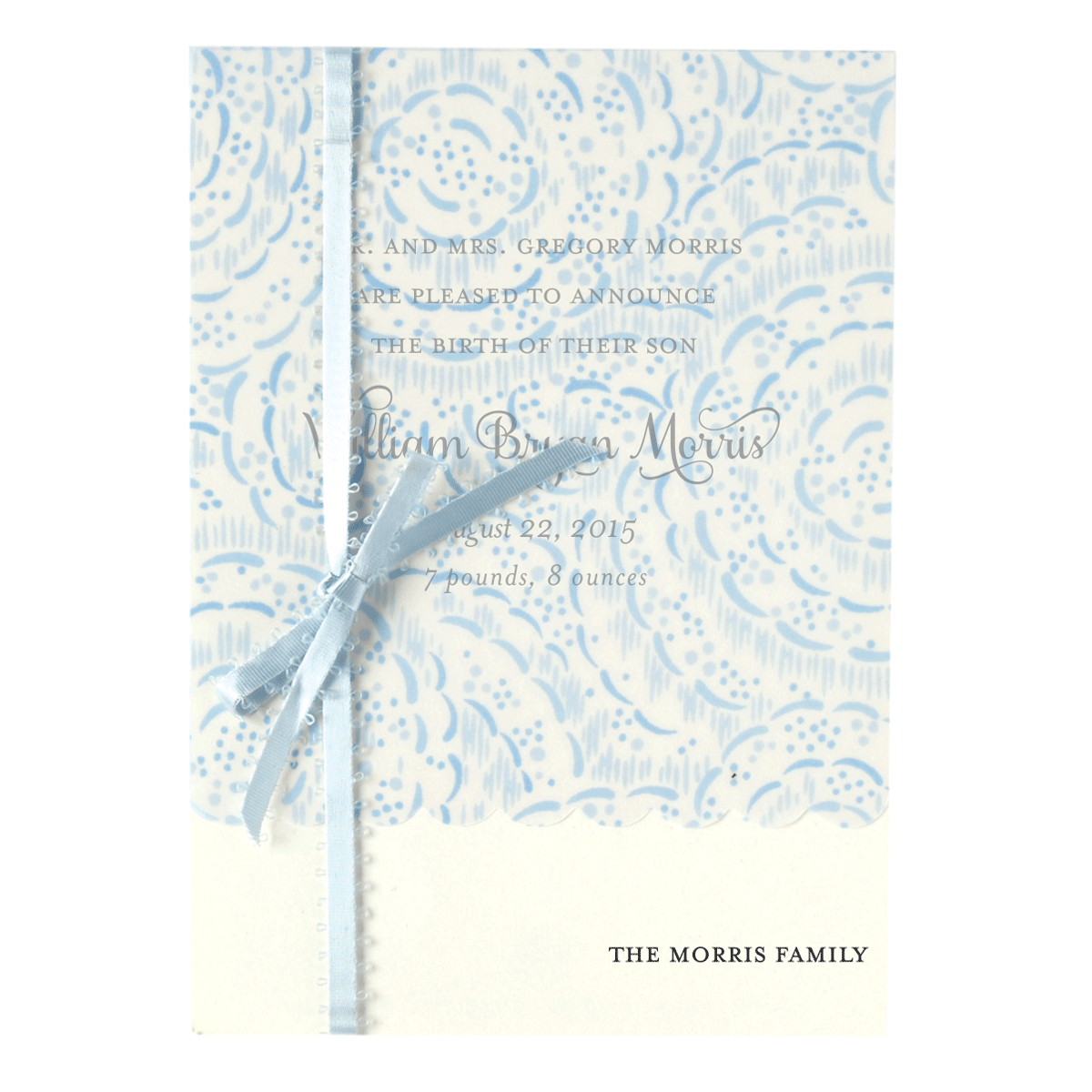 a blue and white wedding card with a ribbon.