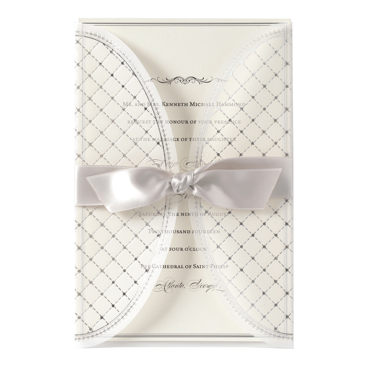 a white wedding card with a bow.