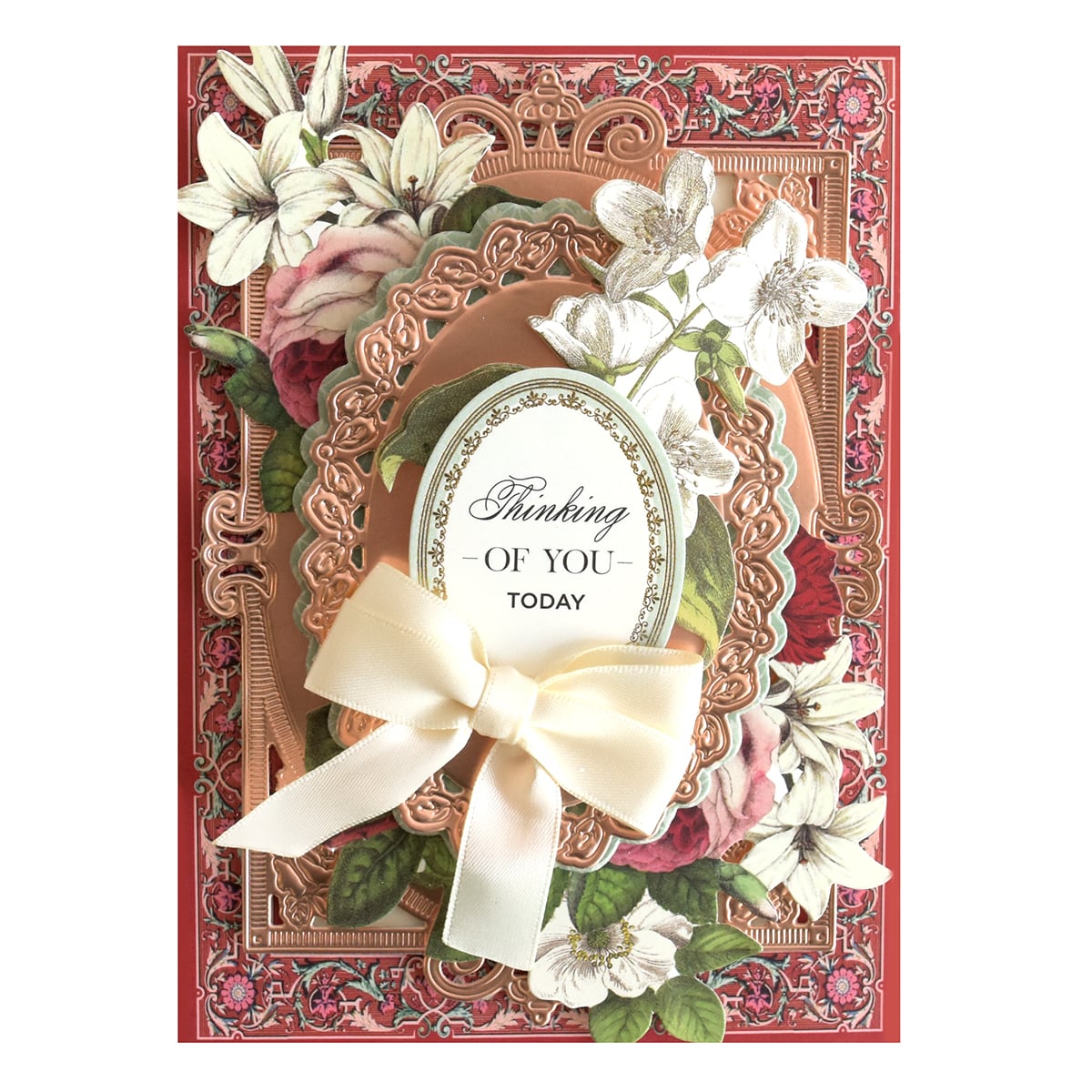 a birthday card with flowers and a ribbon.