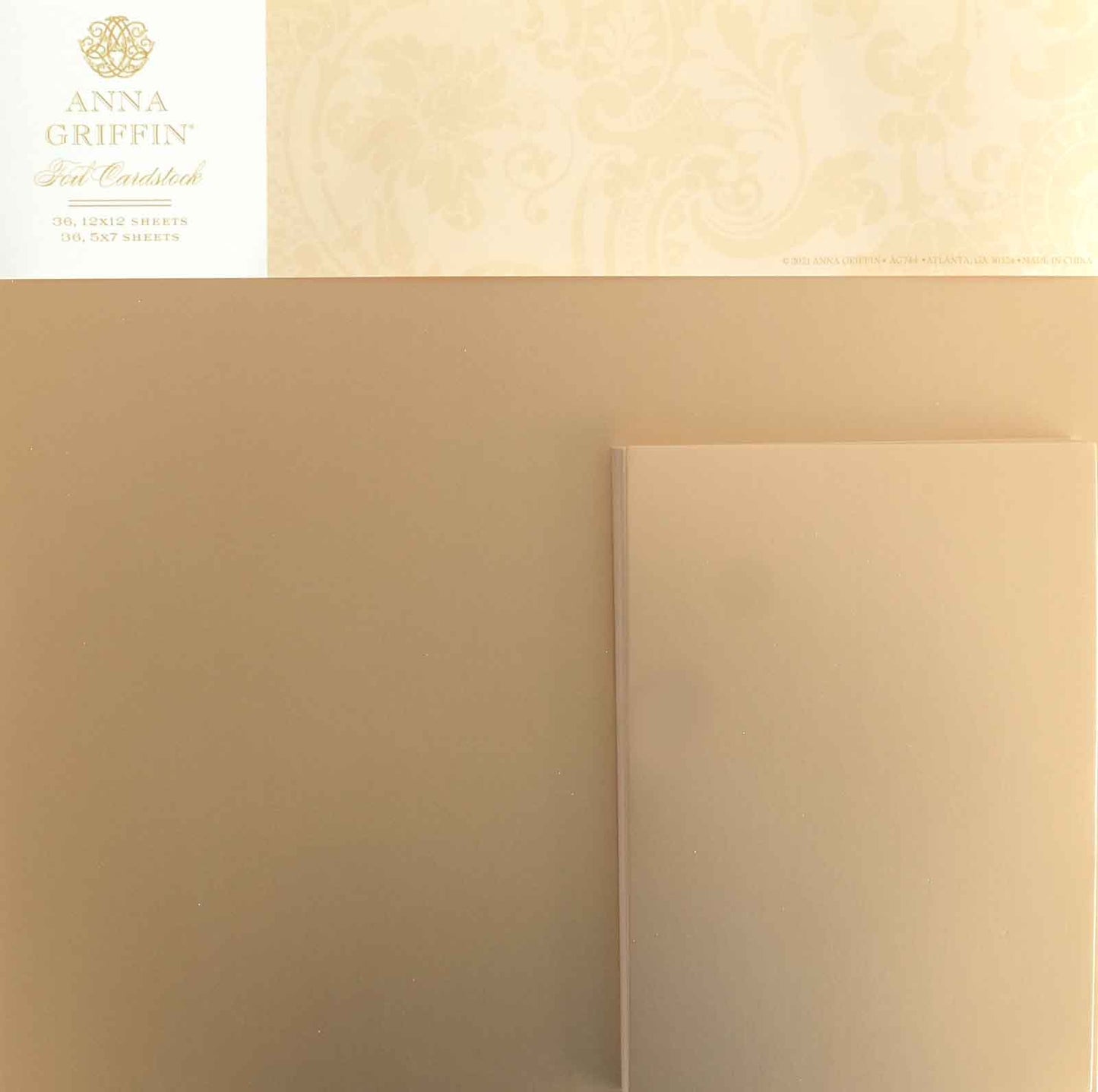 Pack of Foil Matte Cardstock - Rose Gold by Anna Griffin, featuring elegant packaging and a sample sheet.