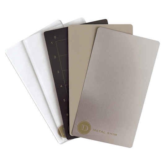 a set of four notebooks sitting next to each other.