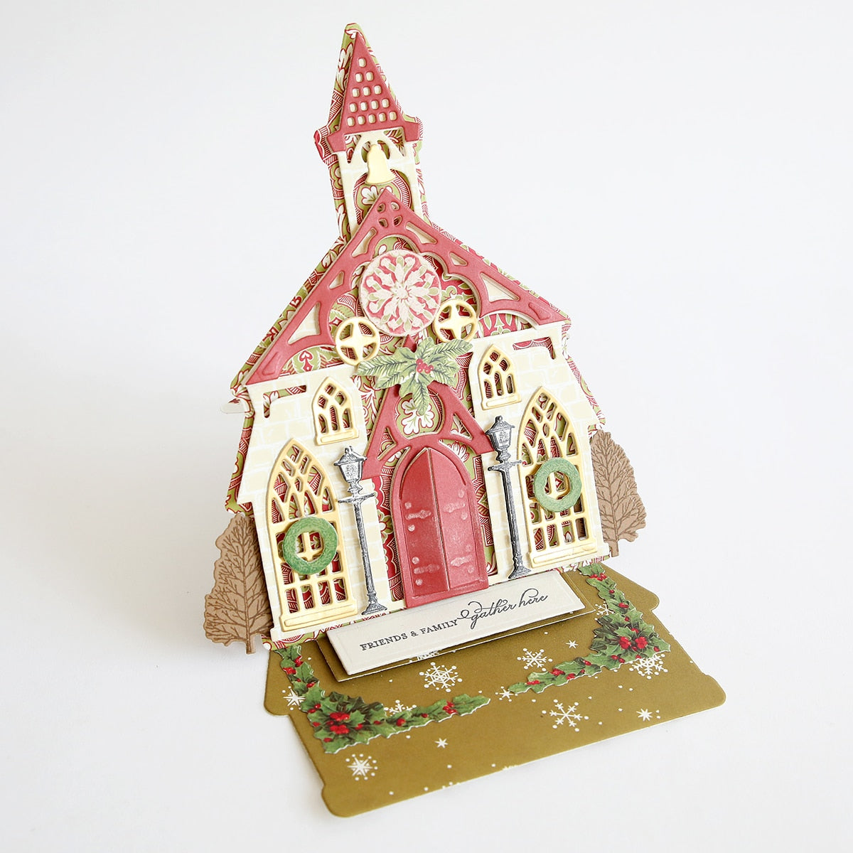 a christmas card with a church on it.