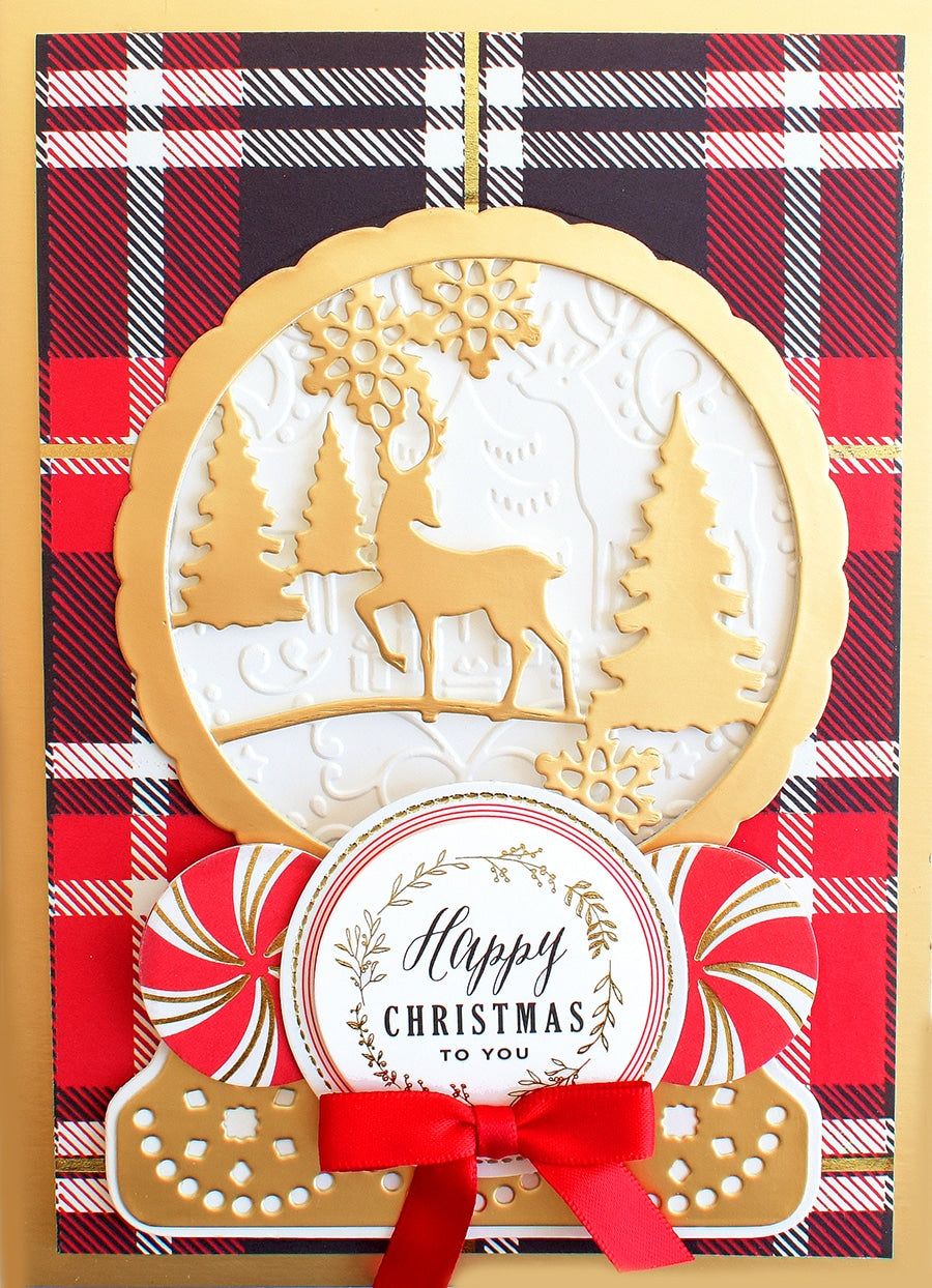 a close up of a christmas card with a red ribbon.