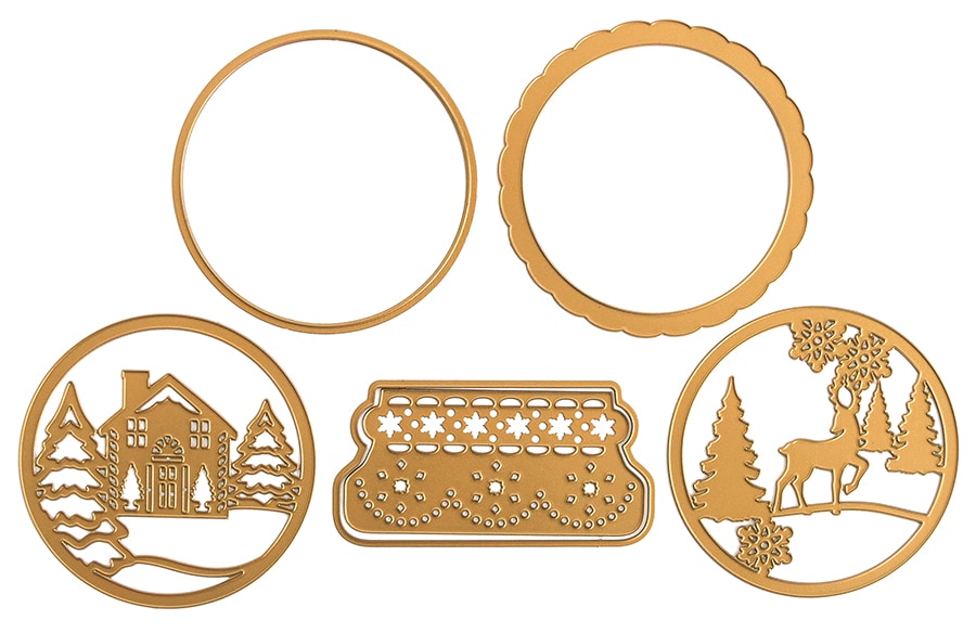 a set of metal cutting dies with a christmas scene.