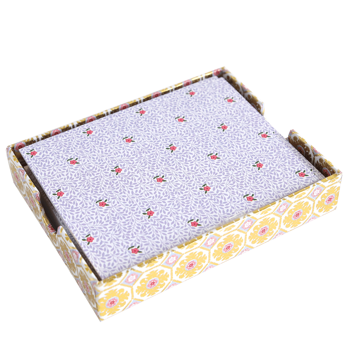 A rectangular box with a yellow and white floral pattern holds Rose Vine Folded A2 Note Cards, featuring a stack of purple cards with small red flower prints.