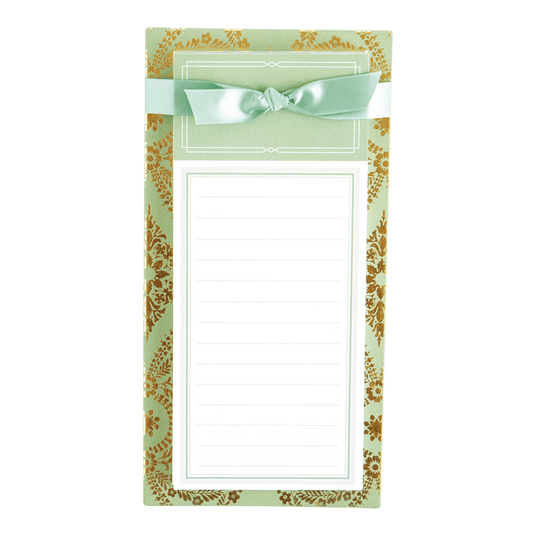 a notepad with a bow on top of it.