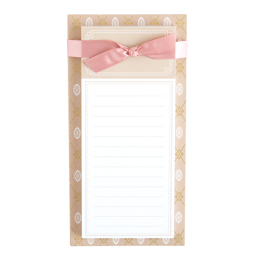 a notepad with a pink bow on it.