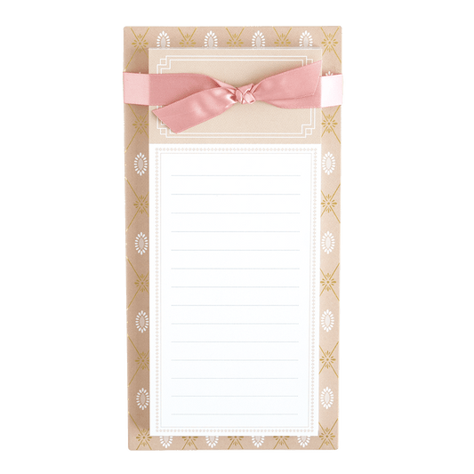 a notepad with a pink bow on it.