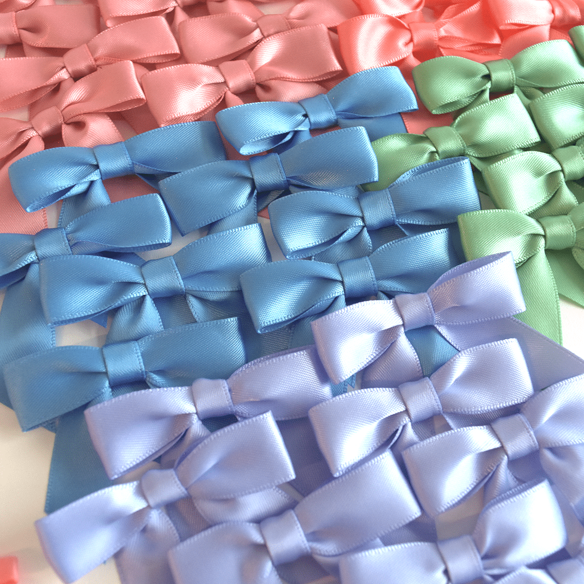 a close up of a bunch of bows on a table.