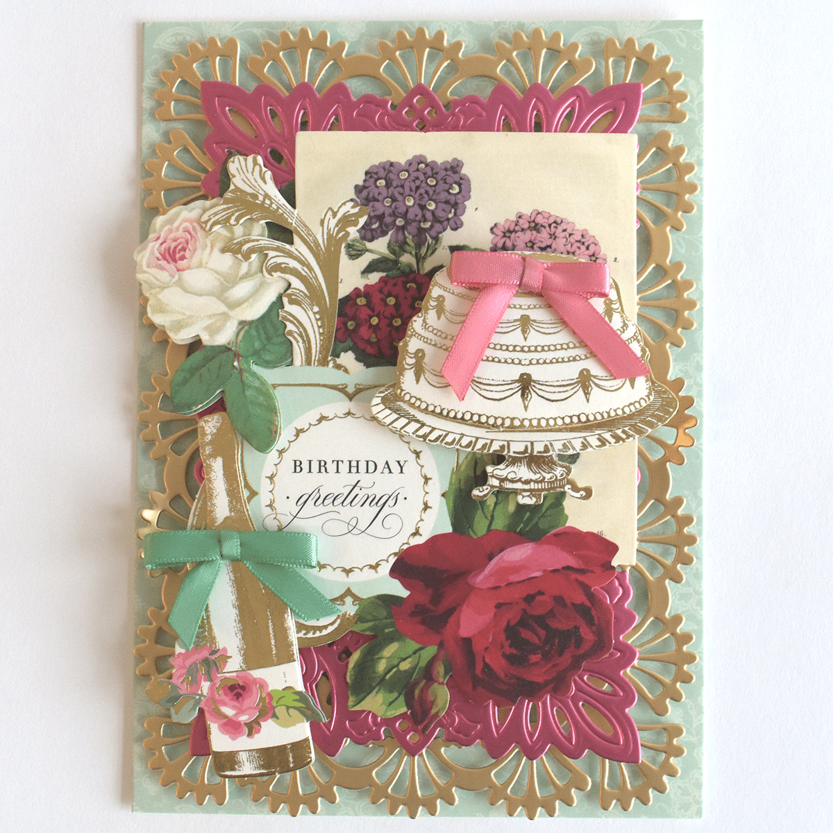 a birthday card with flowers and a cake.