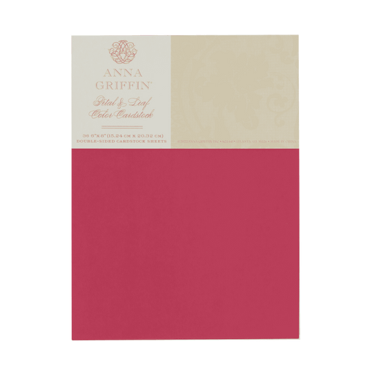 a red and beige paper with a label on it.