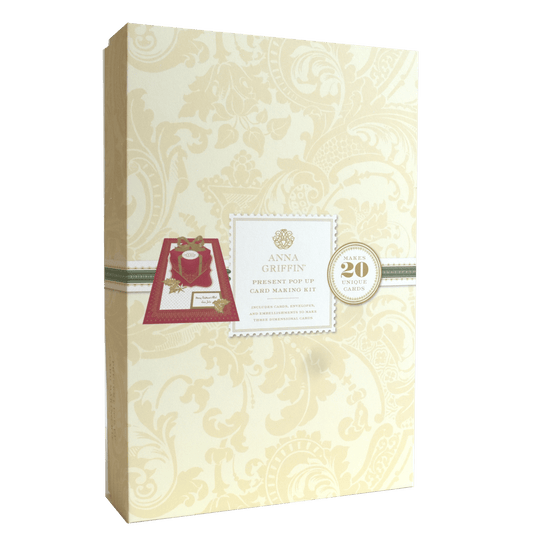 a box with a card inside of it on a green background.