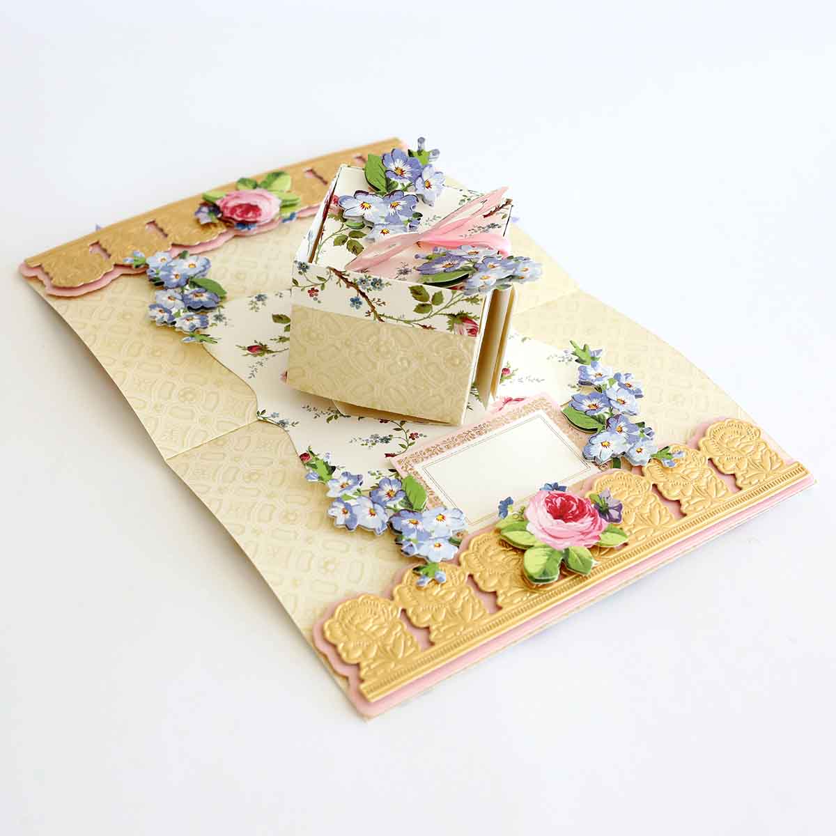 a card with a picture frame and flowers on it.