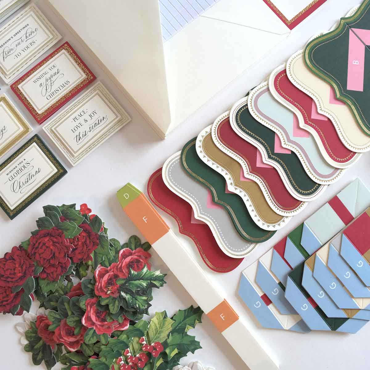 a table topped with lots of cards and flowers.