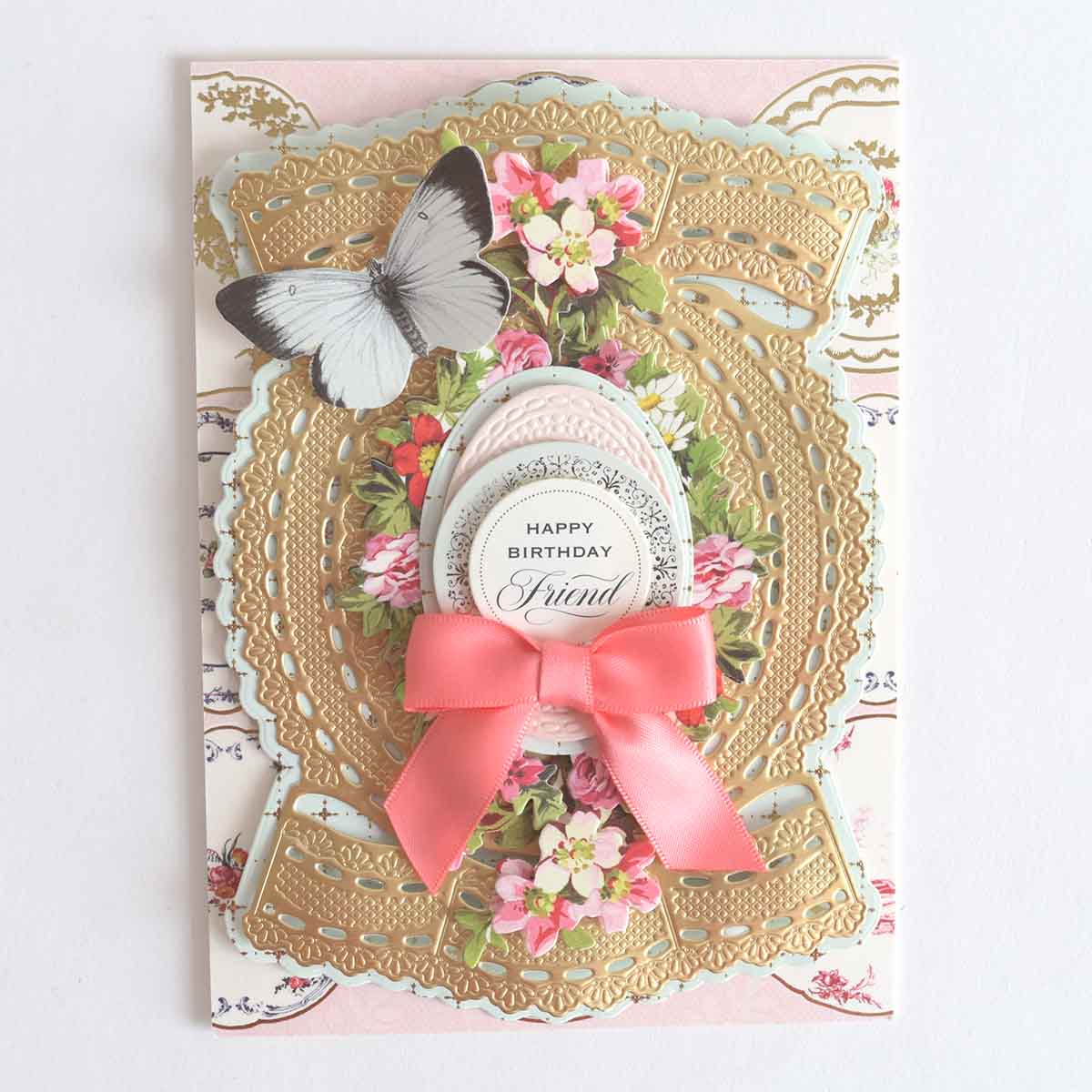 a birthday card with a pink bow and a butterfly.