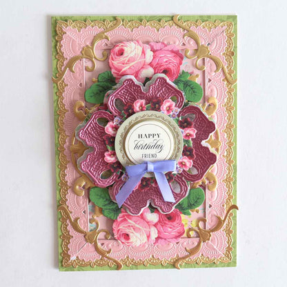 a pink and green card with flowers on it.