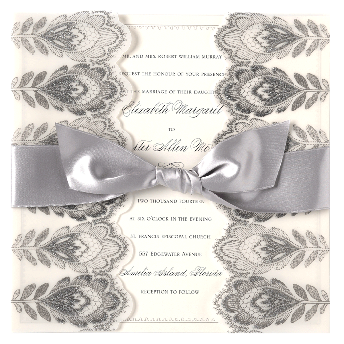 a wedding card with a silver bow on it.