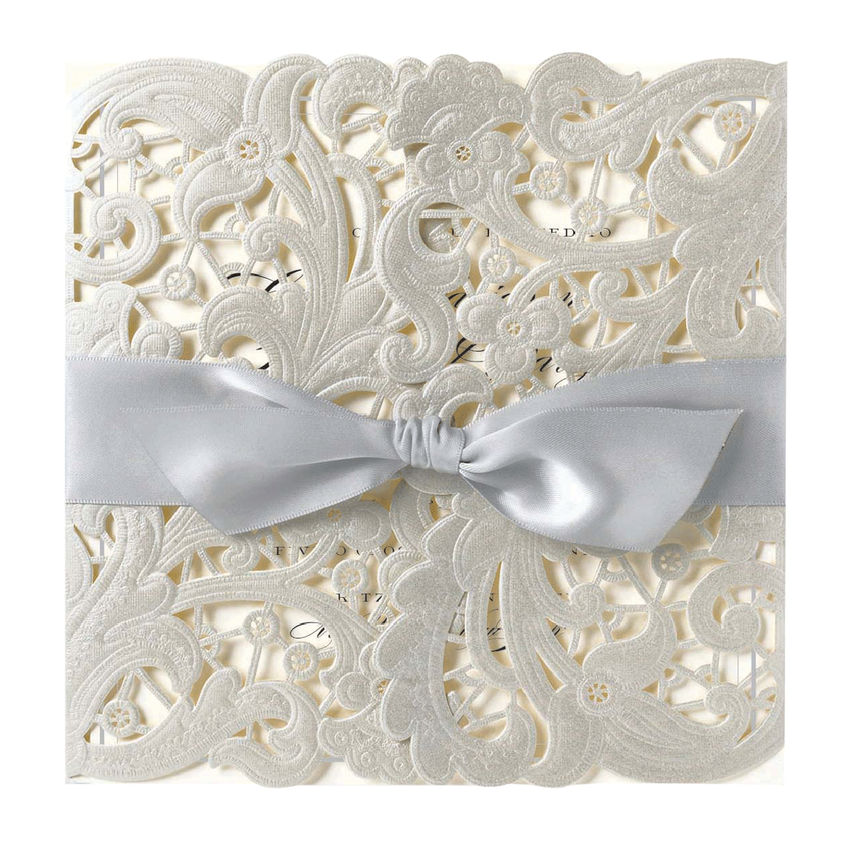a white wedding card with a satin bow.