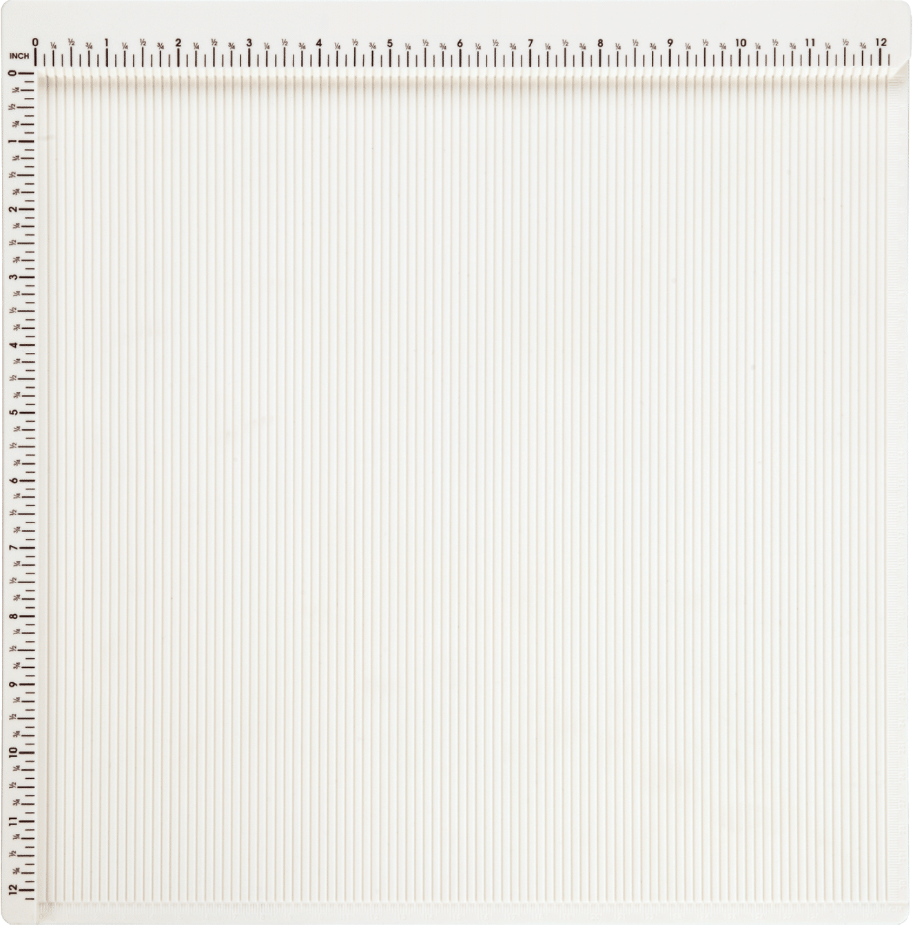 A white sheet of paper with a Scoring Board with Corner Punch and Cardstock on it.
