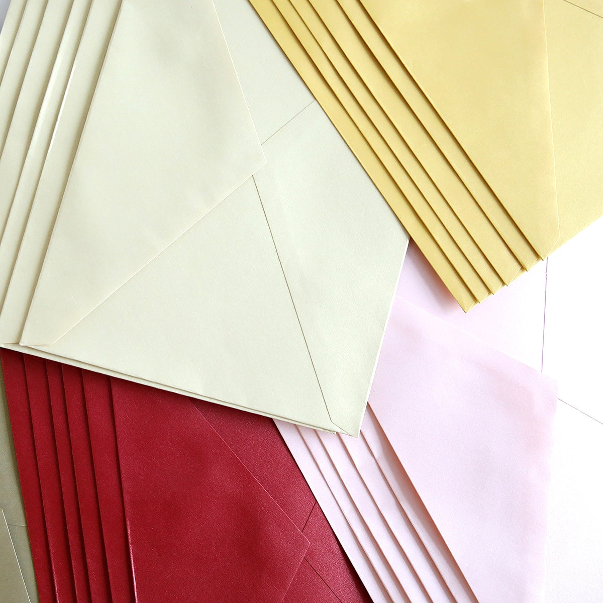 a pile of folded paper sitting on top of each other.