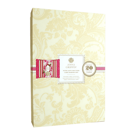 a wedding album with a pink ribbon.