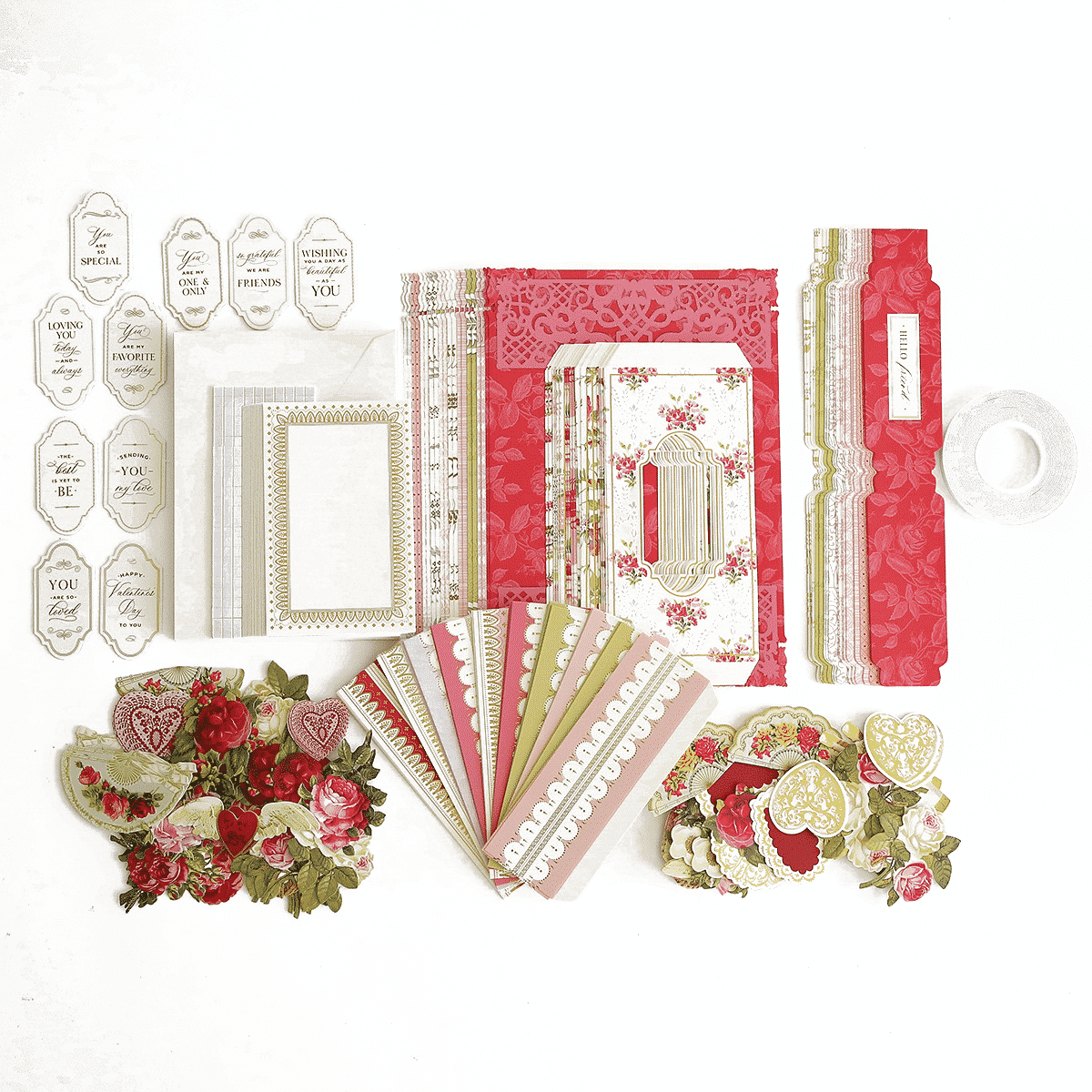 a collection of paper and craft supplies on a white surface.