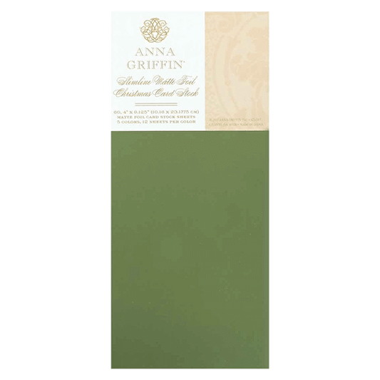 a green card with a gold emblem on it.