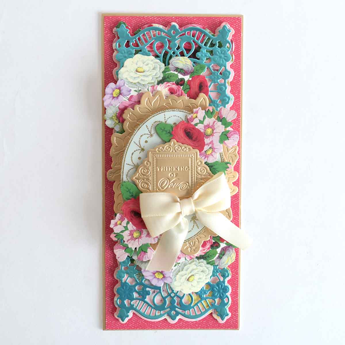 a card with a bow on top of it.