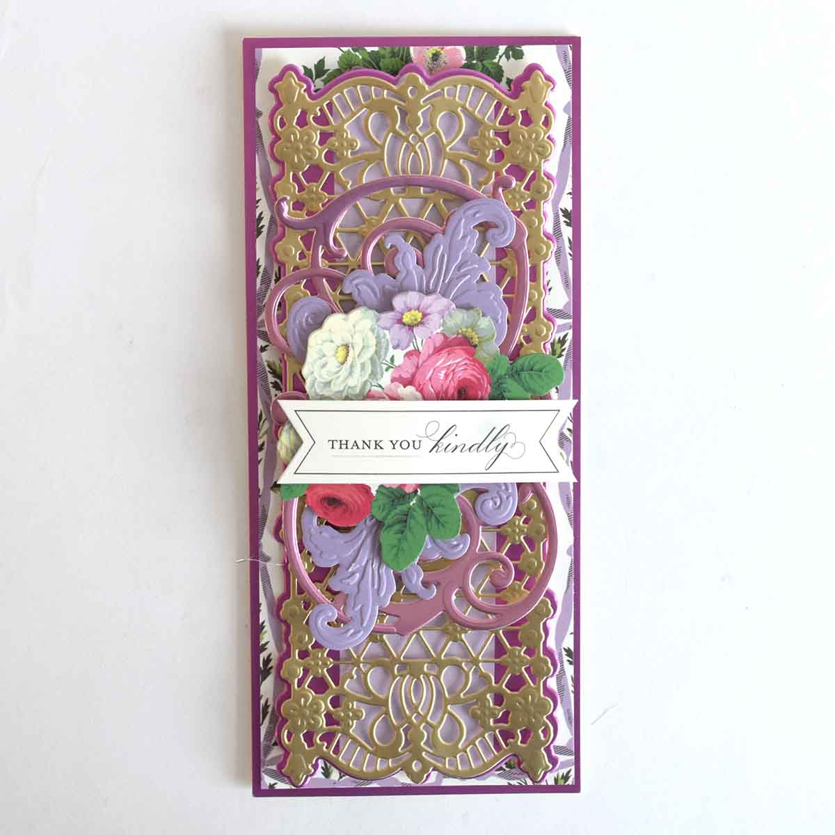 a purple and gold card with flowers on it.