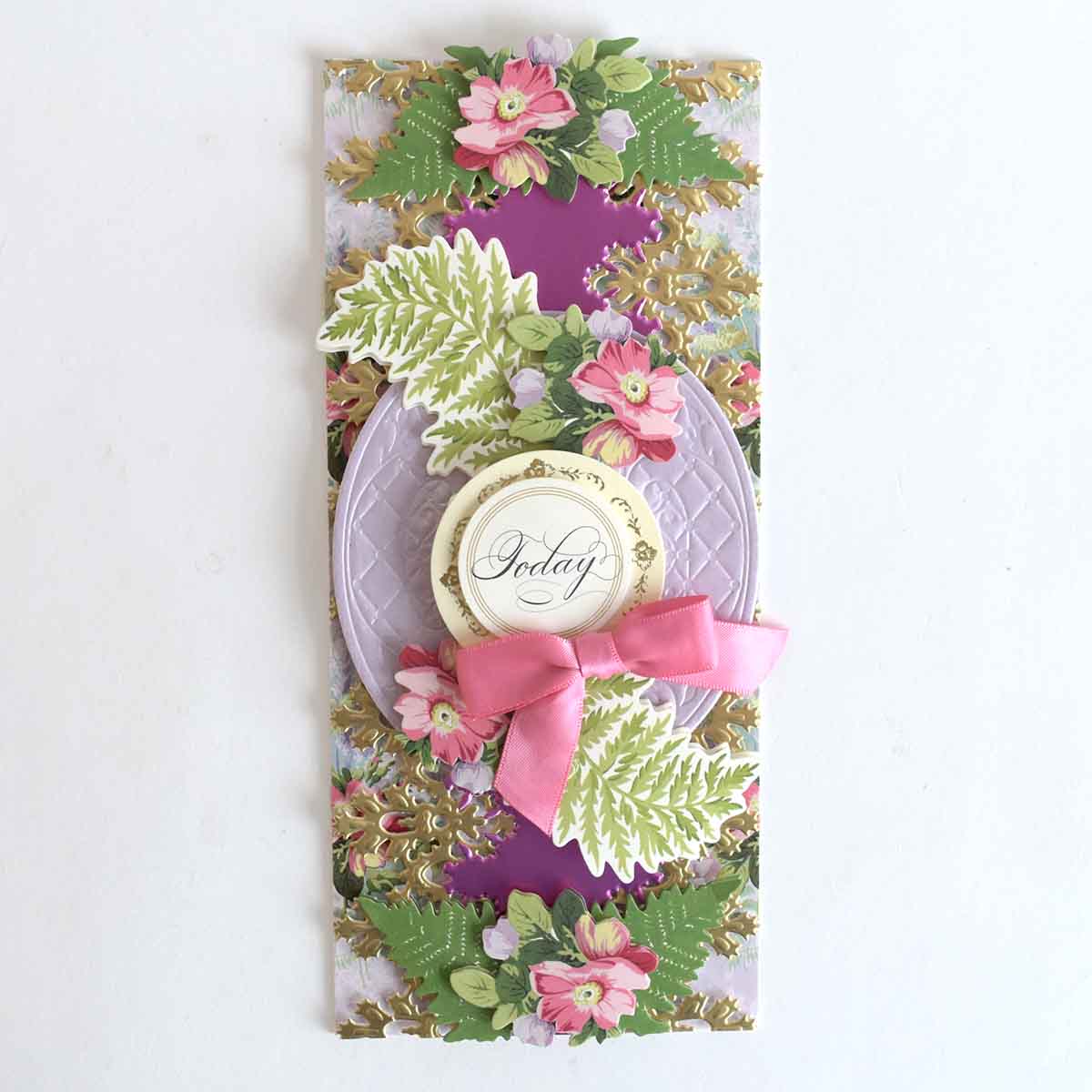 a close up of a card with flowers and a tag.