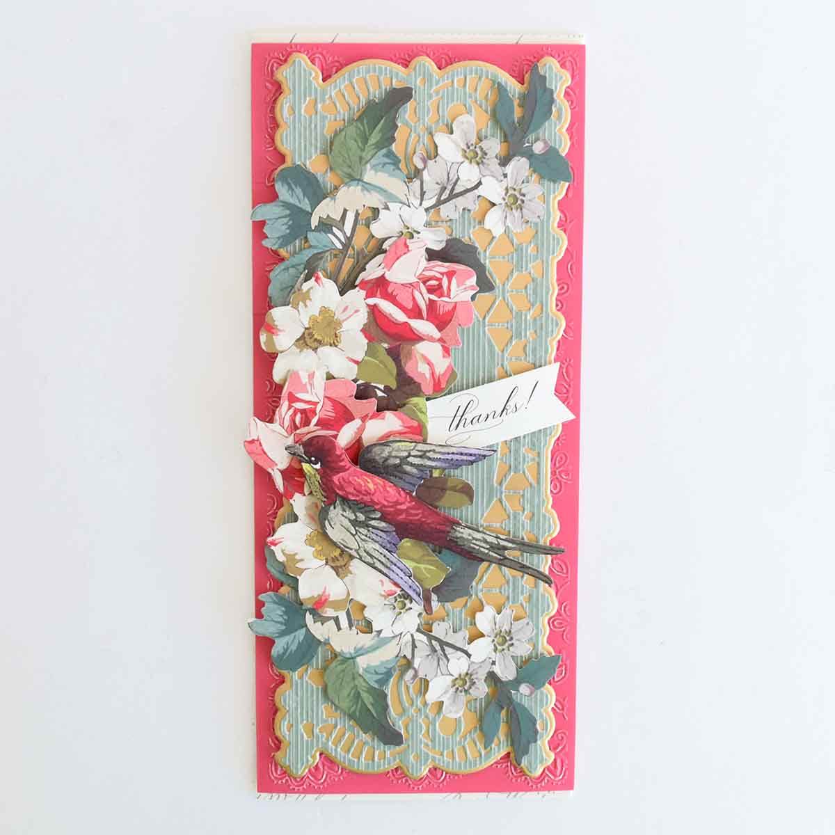 a card with flowers and a ribbon on it.