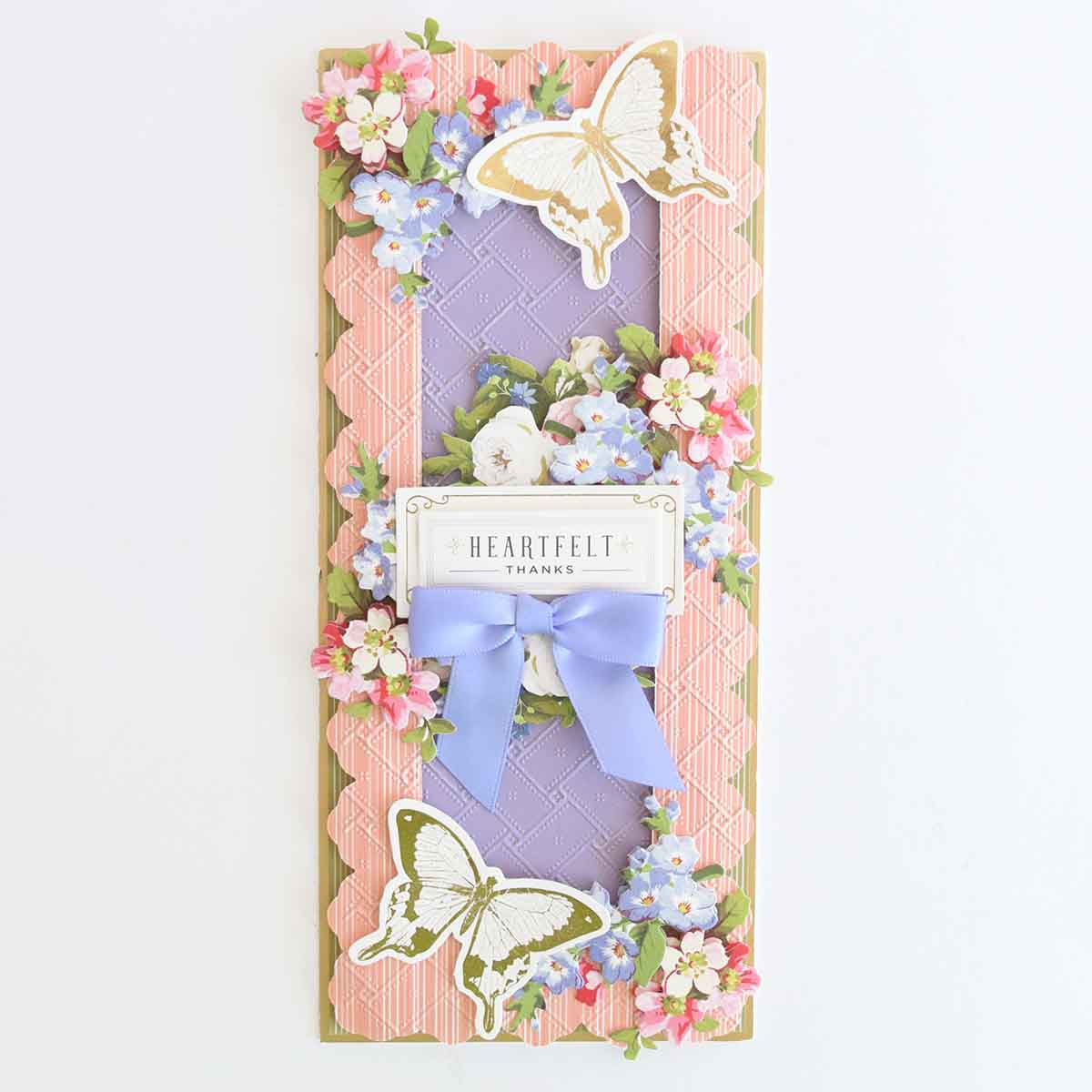 a card with butterflies and flowers on it.