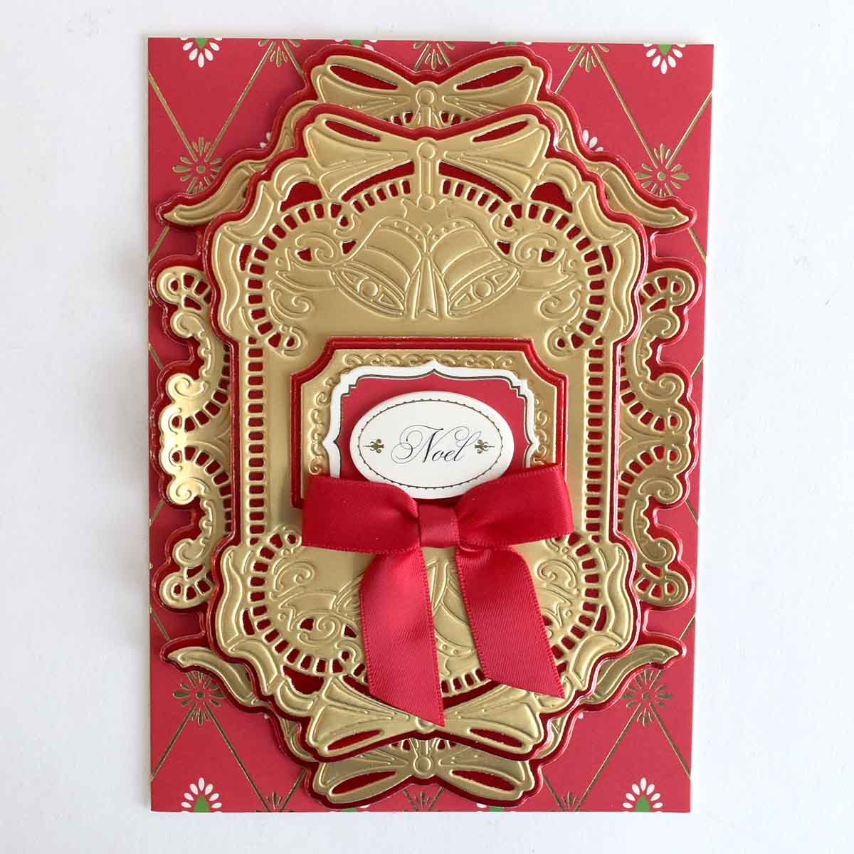 a red and gold card with a red bow.