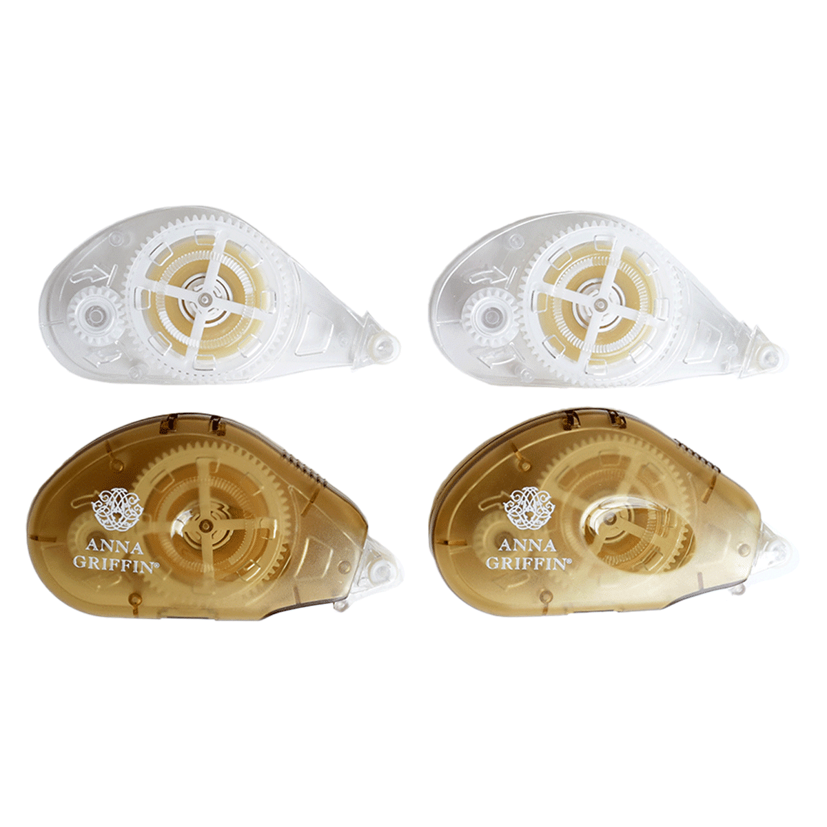 three pieces of plastic with gold and white designs.