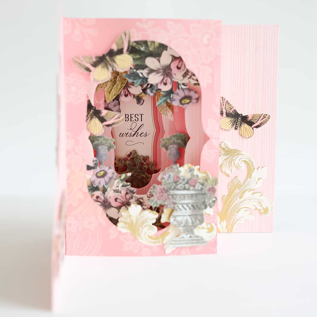 a pink card with a picture of a vase.
