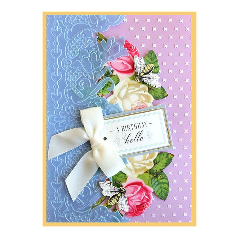 a birthday card with flowers and a ribbon.