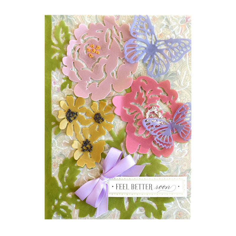 a card with flowers and butterflies on it.