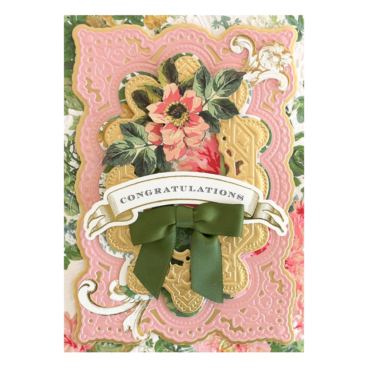 a card with a ribbon and flowers on it.