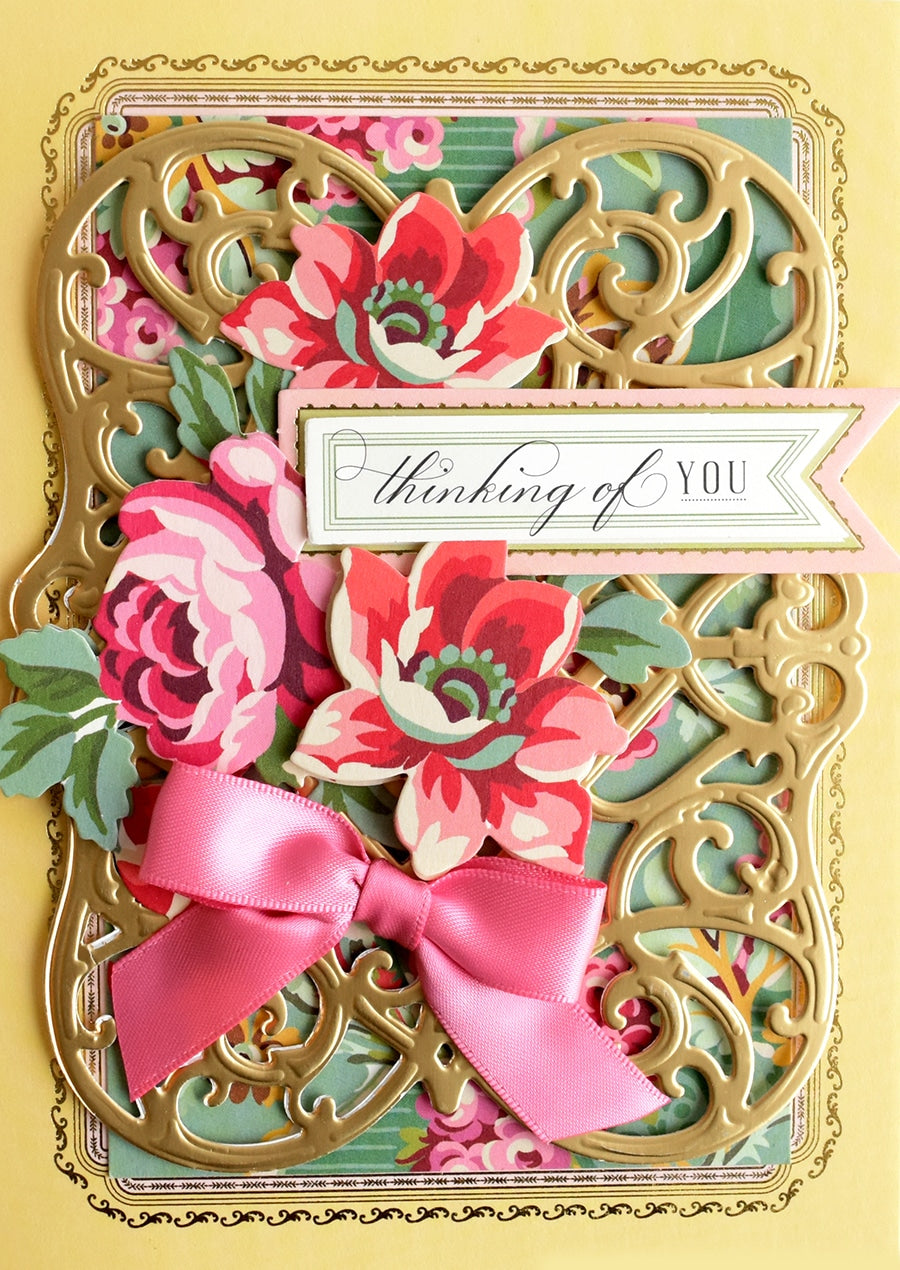 a close up of a card with flowers.
