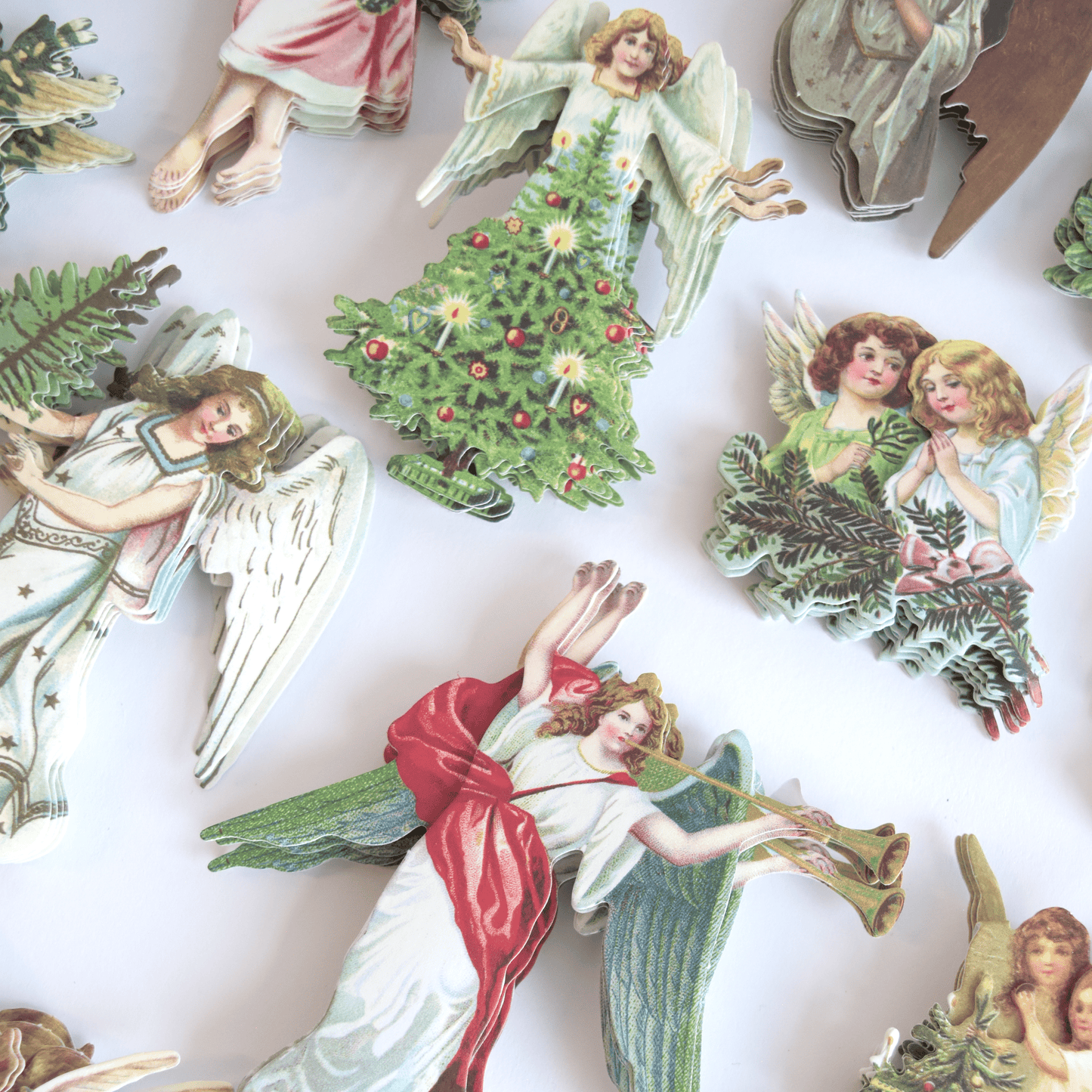 a group of angel figurines sitting on top of a table.