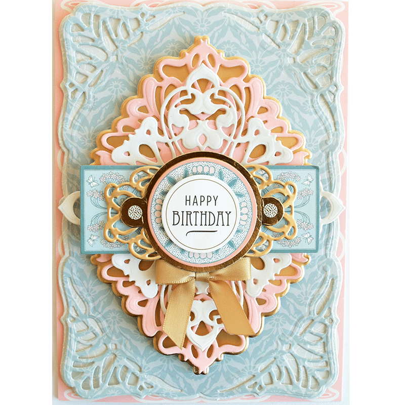 a happy birthday card with a paper doily.