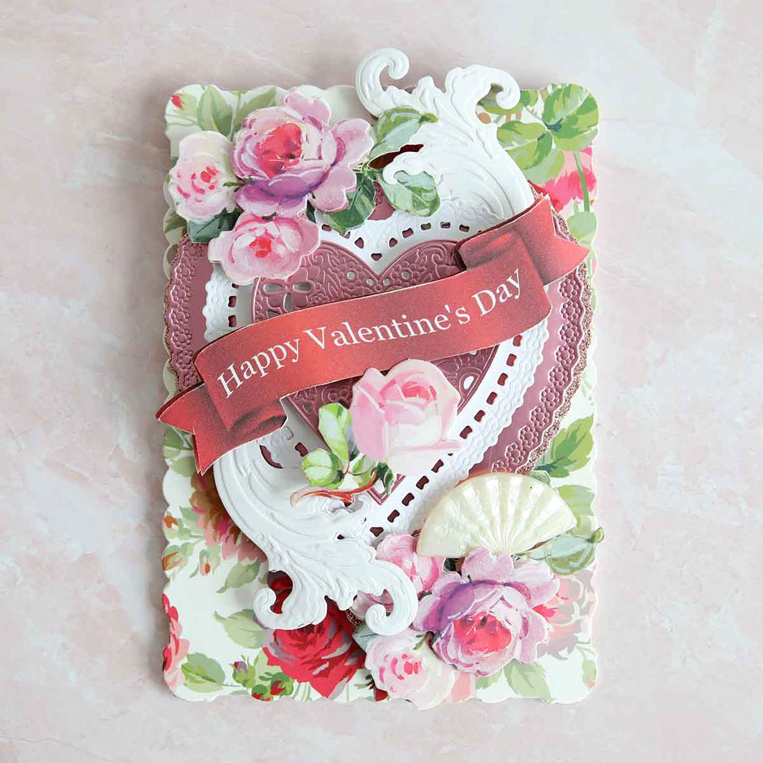 a valentine's day card with roses and seashells.