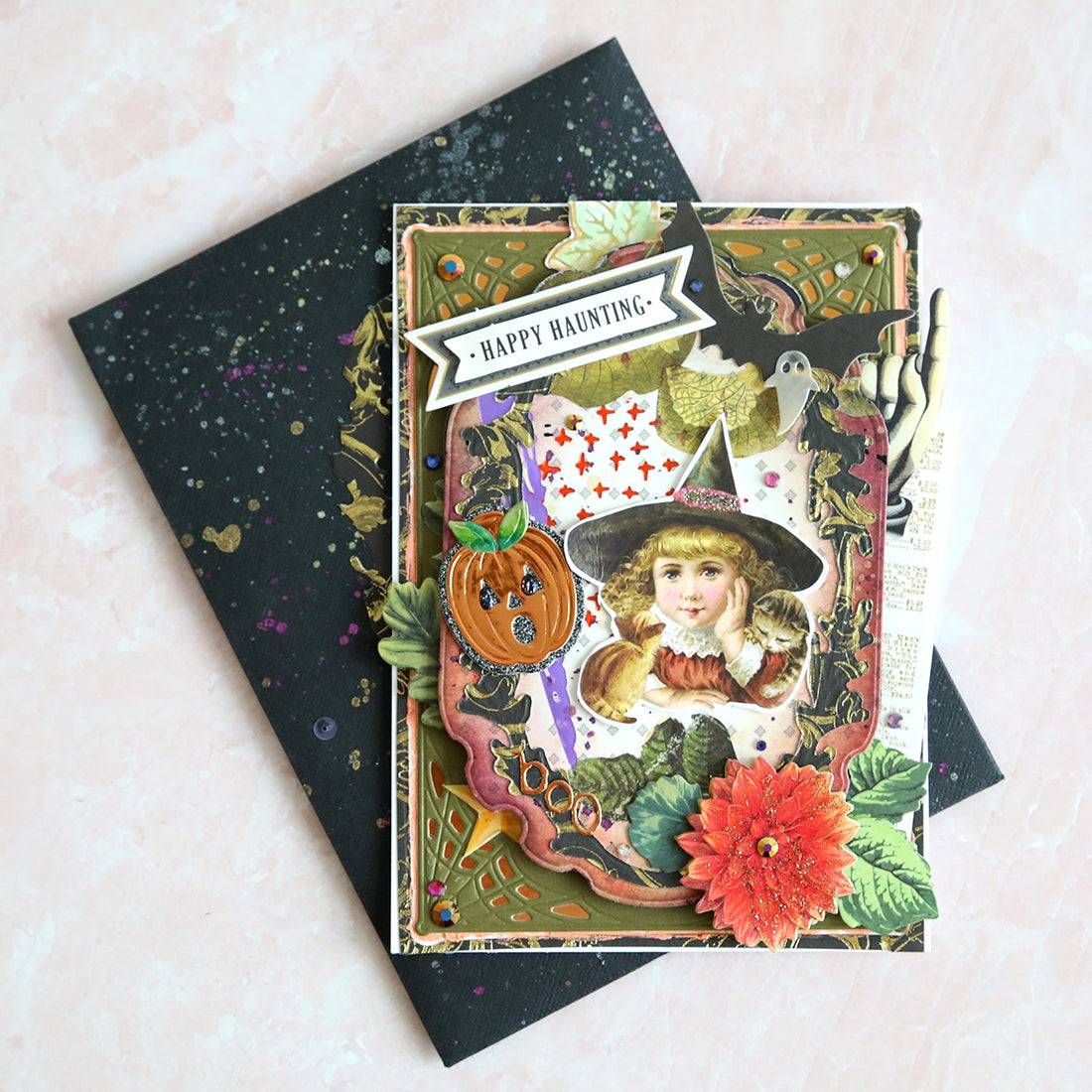 A card with a witch and flowers on it.