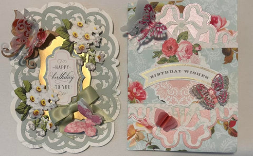 two blue birthday cards with bows and butterflies